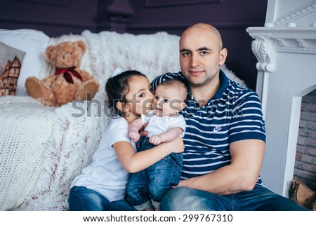 Happy family having fun togethe,Dad and daughter and son hugging and playing