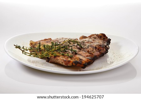 Appetizing grilled rib isolated on white background. Grilled mutton rib with blood