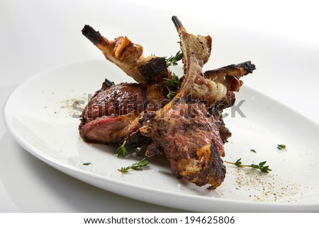 Appetizing grilled ribs isolated on white background. Grilled veal ribs