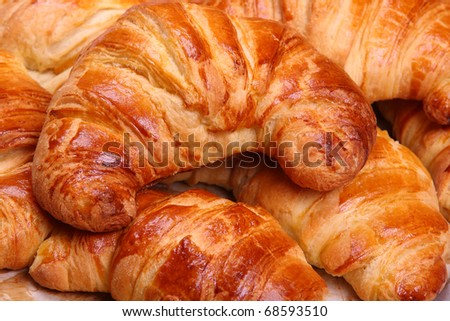 Appetizing croissants on a white background