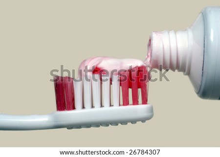 Tooth paste,toothbrush and tube on a light background