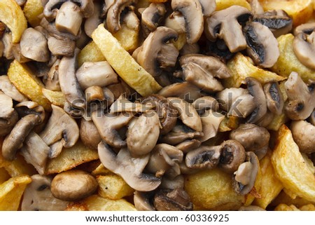 Roast  with baked potatoes and mushrooms , close-up