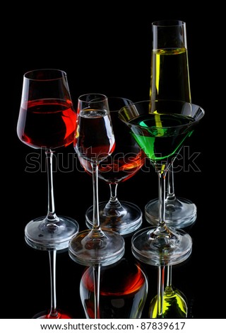 Wine glasses of different profile on a black background