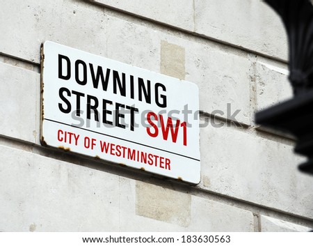 LONDON, UK - APRIL 10, 2009: Downing Street\'s sign in Westminster. Downing St. has housed government leaders for over three hundred years.