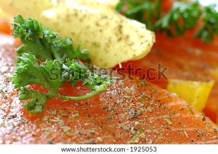 cooking macro, prepared salmon with butter herbs and parsley