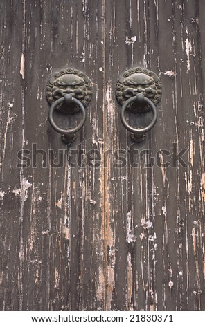 old chinese door with two knockers