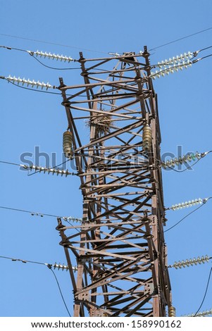 Detail of high voltage Power line against the blue sky