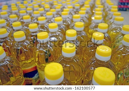 Background of plastic bottles with yellow caps