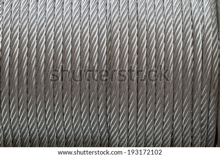 Background of galvanized metal cable on the winch