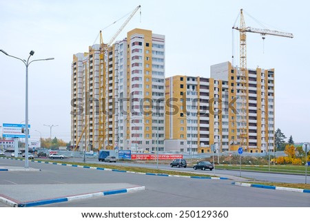 Tambov, Russia - September 28, 2014: Construction of more than sixteen apartment building in the northern city of Tambov. Urban scene in warm overcast autumn day. The quality of medium format