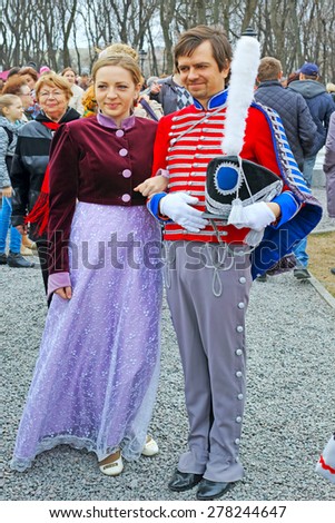 Tambov, Russia - April 26, 2015:  Girl and boy in historical costumes of the nineteenth century. Demonstration of Russian costumes on Park alley near the House Aseeva in Tambov.