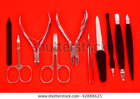 Pedicure and manicure set of ten items on a red background