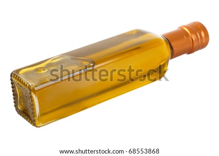 Olive oil in the bottle lying on its side. Isolated object on a white background.