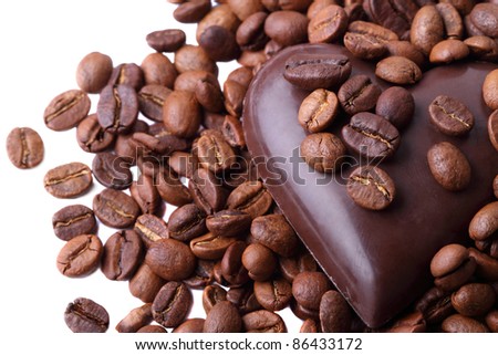 Coffee beans and chocolate in heart shape isolated on a white background