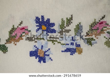 Embroidered cross floral pattern by border tablecloths on coarse cloth