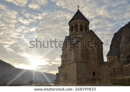 sunrise and clouds over the church in the mountains