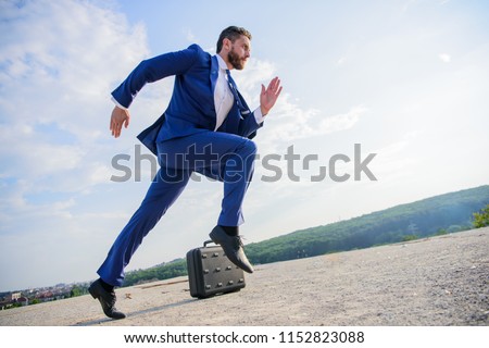 Man concentrated focused on business achievement. Businessman formal suit run outdoors blue sky background. Business as marathon or sprint. Entrepreneur run for success. Towards success.