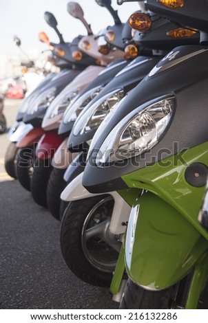 Scooter motorbikes in a row with perspective line