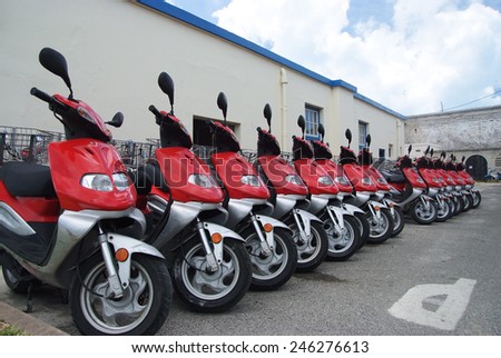 red Scooter motorbikes in a row with perspective line