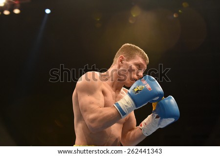 Kyiv, UKRAINE - March 20, 2015 : ZUBENKO Oleg (UA)  in the ring during boxing fight Ukraine Otamans vs China Dragons in Palace of Sport in Kiev, Ukraine