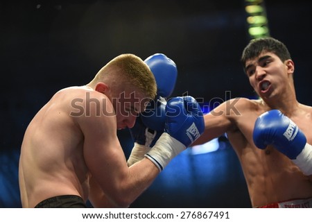 Lviv, UKRAINE -October 4, 2014 : An unidentified boxers in the ring during fight for ranking points in the Arena Lviv Stadium