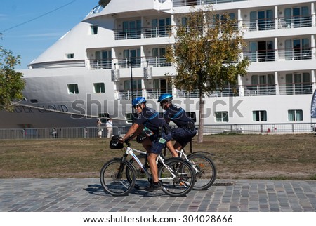 Bordo, France - March 30, 2010: police officer patrol on a bike in Bordo.During police operations many criminals do not realize that an approaching person on a bike is actually a police officer.