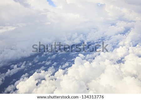 Cumulus clouds over the Atlantic Ocean (type of aircraft). Cuba.