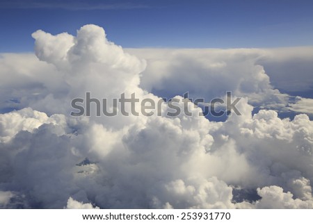 Beautiful clouds over the earth. The view from the aircraft.