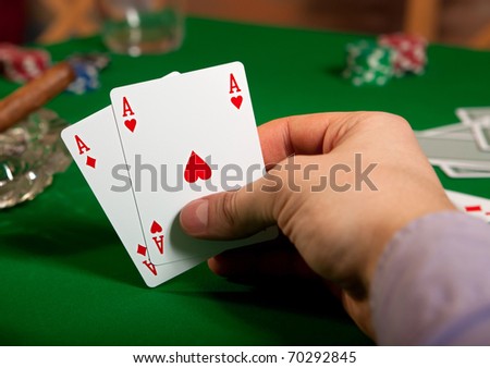 Pair of aces in his hand poker player.