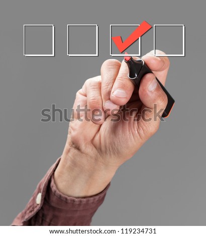 hand with pen mark the check boxes