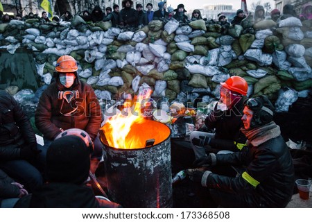 Kiev, Ukraine - January 26, 2014: Euromaidan Protesters Rest And Strengthen Their Barricades On Hrushevskoho Street After Another Night Of Clashes With Riot Police In Kiev, Ukraine.