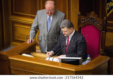 KIEV, UKRAINE - Sep 16, 2014: President of Ukraine Petro Poroshenko signs law on ratification of the Association Agreement between Ukraine and EU during the session of the Verkhovna Rada of Ukraine