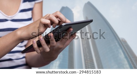 Online Booking. Hotel reservation via Internet. Young woman uses a tablet PC for hotel reservation
