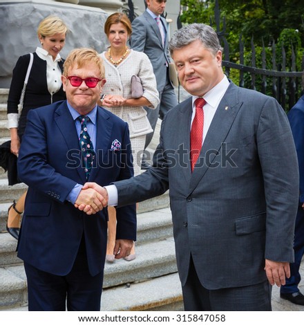 KIEV, UKRAINE - Sep 12, 2015: President Petro Poroshenko had a meeting with world-famous musician, composer and singer Elton John well-known in world for his charitable activity in fight against AIDS