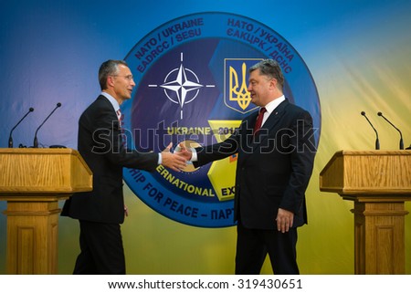 LVIV, UKRAINE - Sep 21, 2015: President of Ukraine Petro Poroshenko and NATO Secretary General Jens Stoltenberg during a visit to the teachings of the Ukraine-NATO disaster relief \