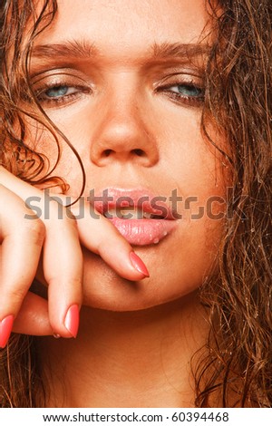 attractive young adult with wet hair looking at camera