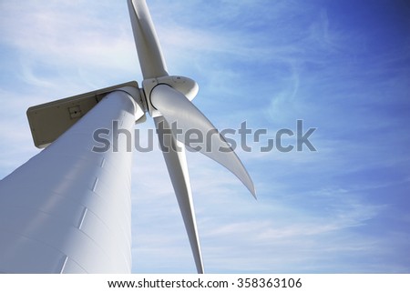 Ecological and renewable energy wind mill against sky with copyspace