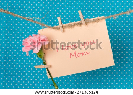 greeting card to Mother\'s Day  with pink carnation and the inscription \