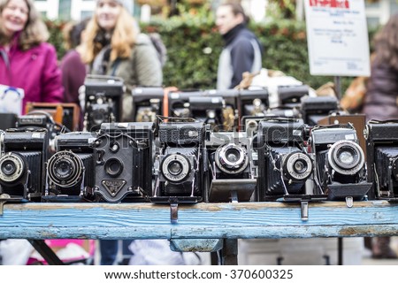 London - January 29. Portobello market with old-fashioned goods displayed in London, UK, on 29 January 2016. Vintage Cameras on a banquet in Portobello road, Notting Hill, for saturdays famous market.