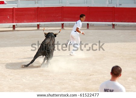 ARLES - JULY 9: Trainees of the school for Raseteur in Arles Daumas fights against a Camargue-bull in the arena on July 09, 2010 in Arles, Bouche du Rhone, France