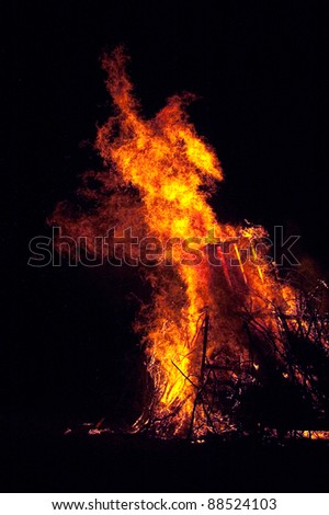 Blazing campfire on a black background