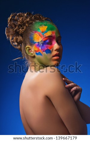 Portrait girl with body painted flower face