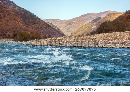 autumn landscape mountain river mountains covered with colorful vegetation Russian North Caucasus
