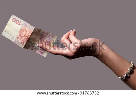hand of a girl who keeps the money paper money