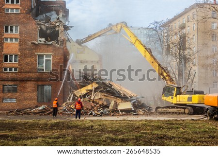 excavator demolishes old soviet school building in moscow