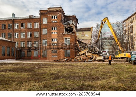 excavator demolishes old soviet school building in moscow