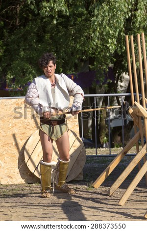 MOSCOW, RUSSIA - JUNE 7, 2015: Roman gladiator in the arena with javelin in his hand at Times and Epochs: Rome historical festival