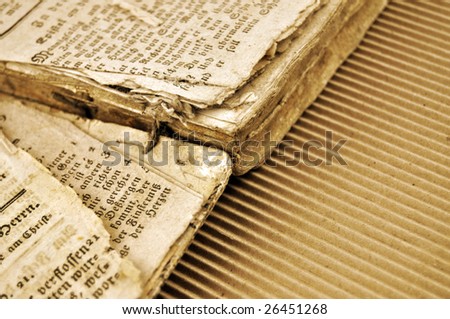 Detail of the very old book torn apart in sepia