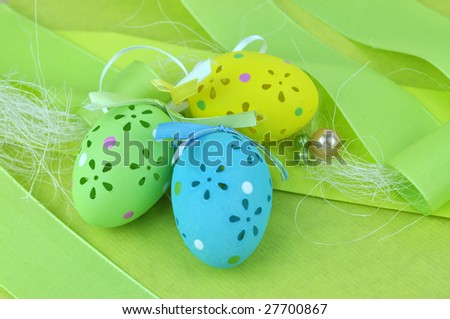 Colorful, beautifully crafted Easter eggs on green decoration