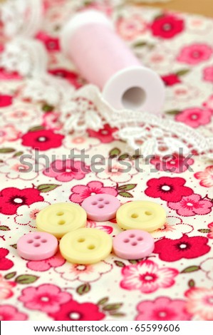 Sewing items on floral cloth